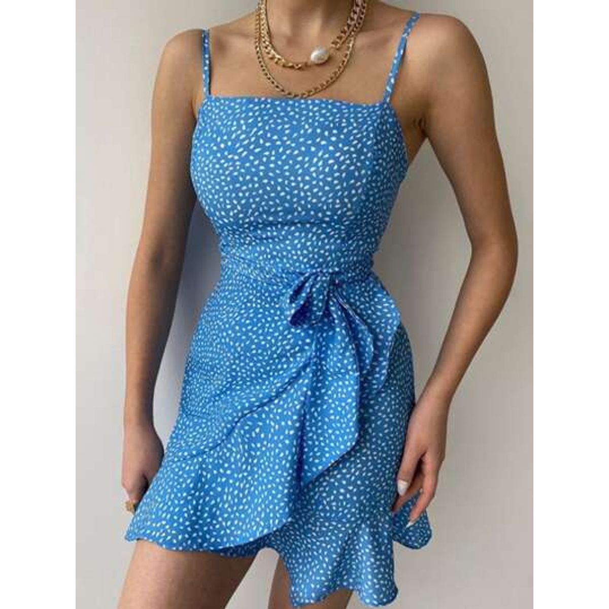 Blue dress with ruffles and a bow at the waist